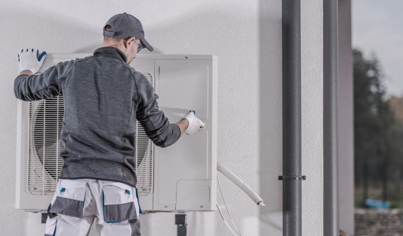 Man working on heating unit